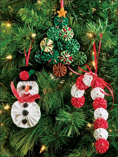 These ornaments were made by combining fabric yo yos together into various shapes.