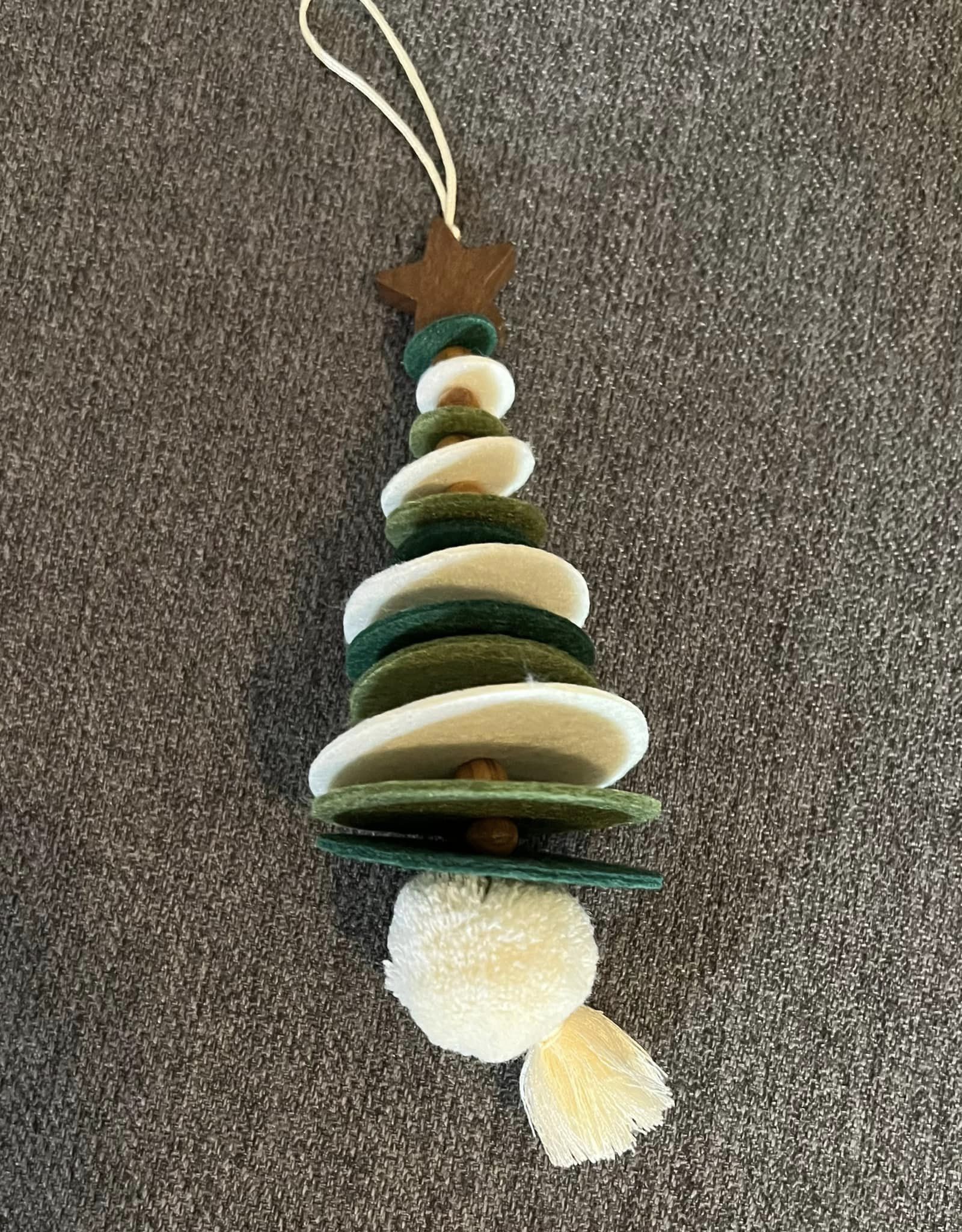 Felt circles with wooden beads between each. There is a pompom with a tassel at the bottom and a wooden star bead at the top.